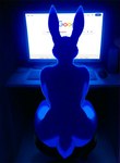 backlighting big_butt biped butt casual_nudity chair computer desk electronics female fur furniture humor light nude nude_female rear_view sitting solo table text otteranon lagomorph leporid mammal rabbit english_text hi_res lighting