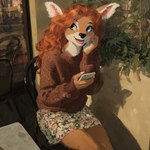 anthro black_nose bottomwear brown_clothing chair clothing countershading curled_hair eyebrows eyelashes female floral_print fluffy freckles fur furniture green_eyes hair inner_ear_fluff inside nails open_mouth pink_inner_ear plant red_hair ring skirt smile solo sweater table tan_body tan_fur teeth topwear tuft sappy cervid mammal hi_res shaded
