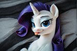 bed blep female female_focus feral furniture looking_at_viewer on_bed solo solo_focus teasing tongue tongue_out jelloponies friendship_is_magic my_little_pony rarity_(mlp) equid equine horse mammal pony portrait